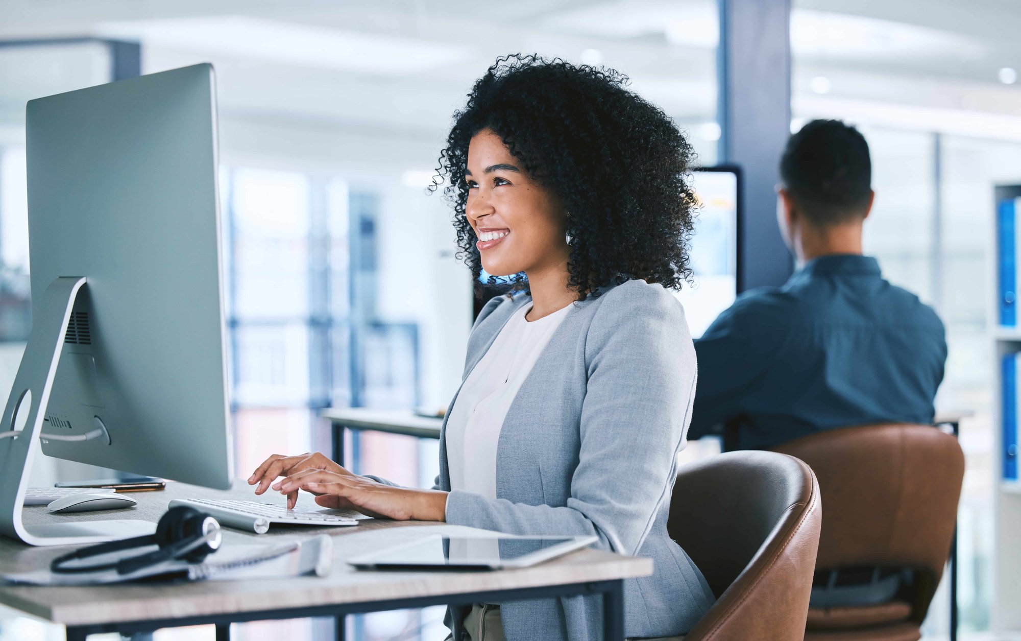 Woman, typing at computer with online tech support and email_608097466-min